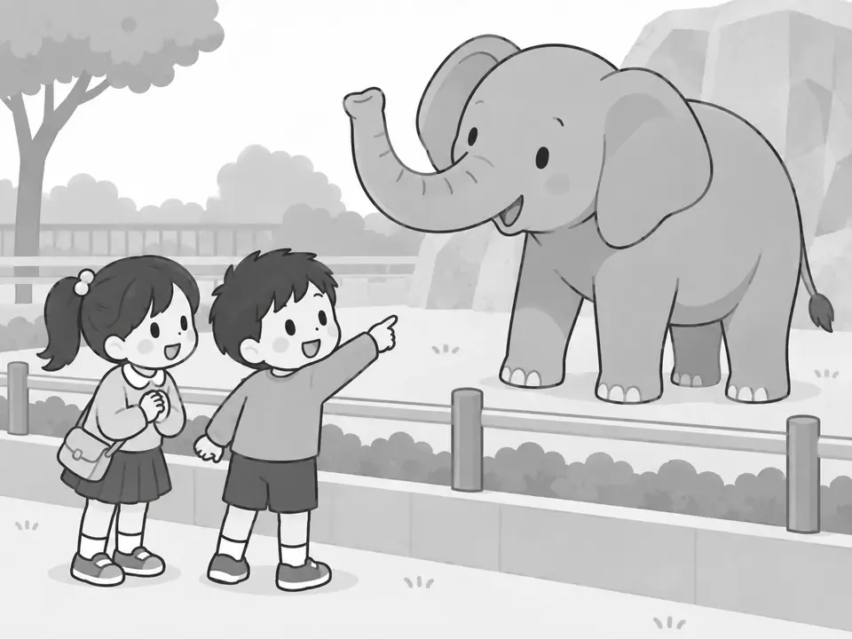 動物園で、男の子がゾウを指さし、左の女の子も笑顔でゾウを見ています。
